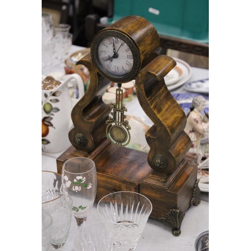 295 - A BATTERY OPERATED WOODEN MANTEL CLOCK WITH DRAW - APPROXAMTLEY 38CM