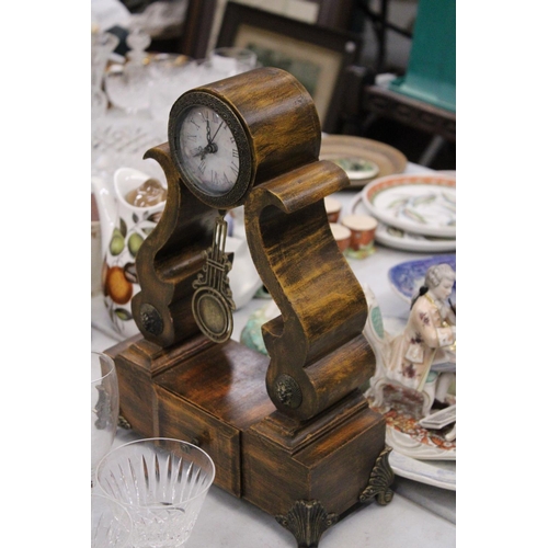 295 - A BATTERY OPERATED WOODEN MANTEL CLOCK WITH DRAW - APPROXAMTLEY 38CM