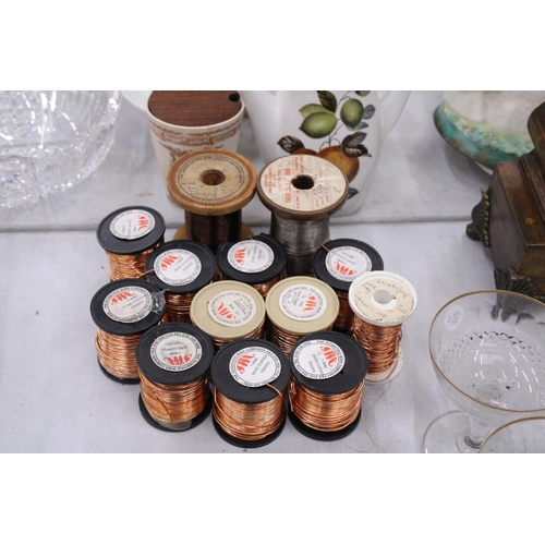 297 - TWELVE SPOOLS OF COPPER WIRE AND ONE SPOOL OF IRON WIRE