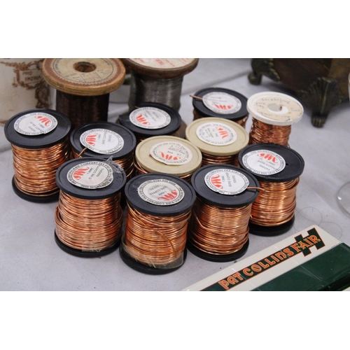 297 - TWELVE SPOOLS OF COPPER WIRE AND ONE SPOOL OF IRON WIRE