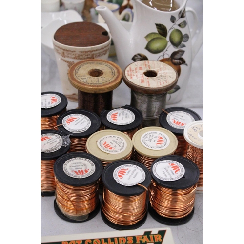 297 - TWELVE SPOOLS OF COPPER WIRE AND ONE SPOOL OF IRON WIRE