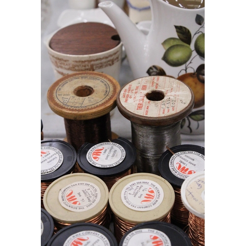 297 - TWELVE SPOOLS OF COPPER WIRE AND ONE SPOOL OF IRON WIRE