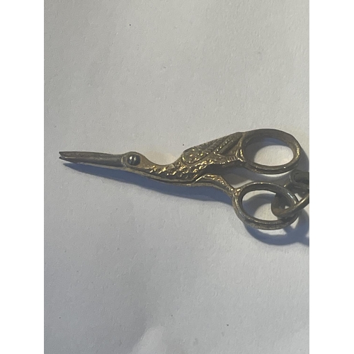 67 - AN ANTIQUE PAIR OF MINIATURE SCISSORS IN A STORK DESIGN AND PEN KNIFE WITH A BROWN CASE LABELLED SHA... 