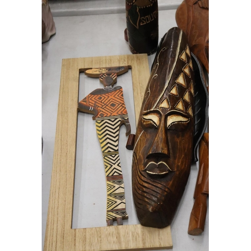 180 - A LARGE COLLECTION OF AFRICAN MASKS, ETC