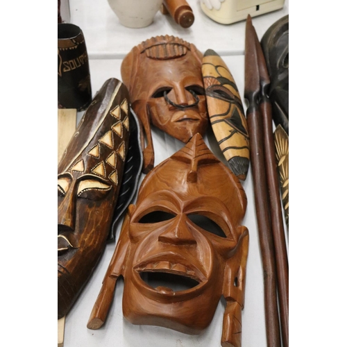 180 - A LARGE COLLECTION OF AFRICAN MASKS, ETC