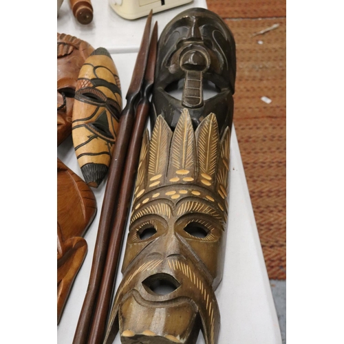 180 - A LARGE COLLECTION OF AFRICAN MASKS, ETC