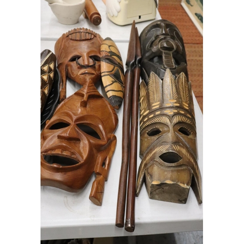 180 - A LARGE COLLECTION OF AFRICAN MASKS, ETC