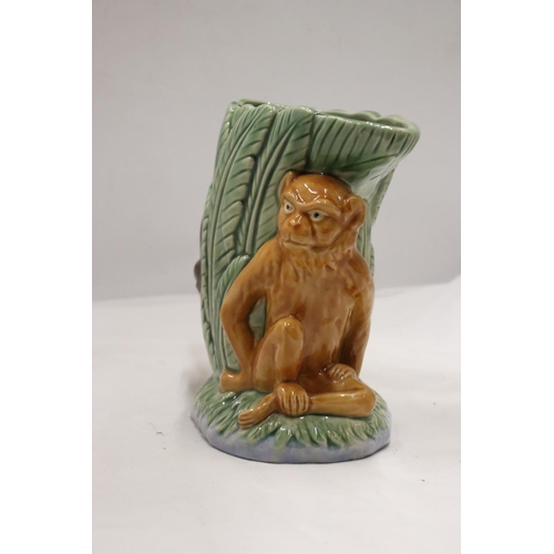 230A - A MAJOLICA STYLE MONKEY VASE