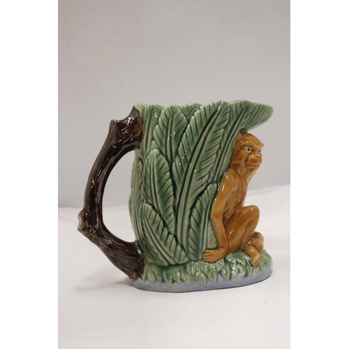 230A - A MAJOLICA STYLE MONKEY VASE