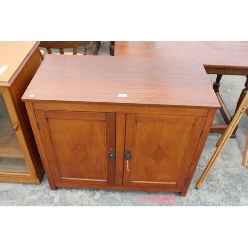 2913 - A TEAK TWO DOOR CABINET