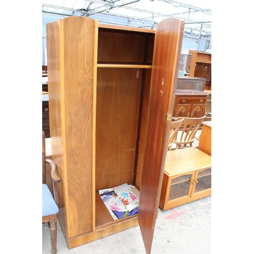 2915 - A MID TWENTIETH CENTURY WALNUT SINGLE DOOR WARDROBE