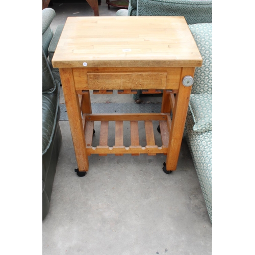 2921 - A MODERN KITCHEN WORK TABLE ON CASTERS WITH WOODBLOCK TOP WITH SINGLE DRAWER AND PULL-OUT SLIDE, 26