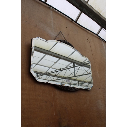 2938 - A MID CENTURY FRAMELESS WALL MIRROR WITH OAK FOLIATE DECORATION