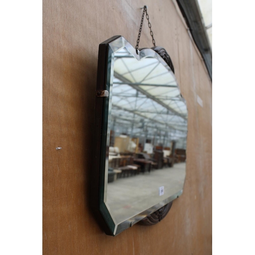 2938 - A MID CENTURY FRAMELESS WALL MIRROR WITH OAK FOLIATE DECORATION