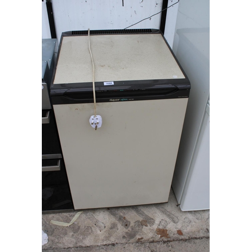 2309 - A BROWN AND CREAM HOTPOINT UNDER COUNTER FREEZER