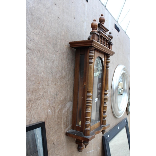 2884A - A VICTORIAN EIGHT DAY WALL CLOCK WITH ROMAN NUMERALS