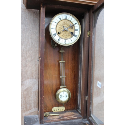 2884A - A VICTORIAN EIGHT DAY WALL CLOCK WITH ROMAN NUMERALS