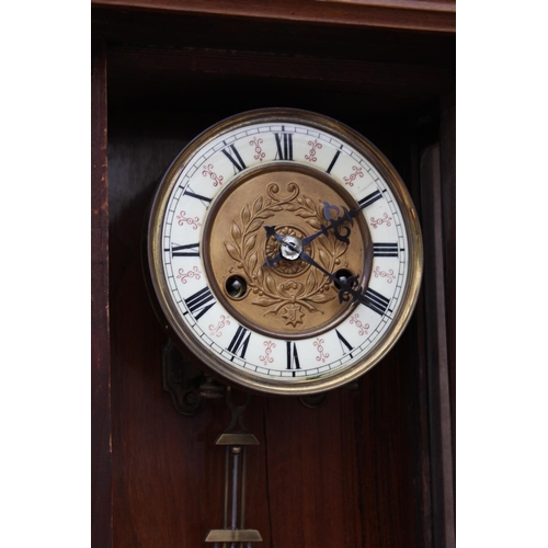 2884A - A VICTORIAN EIGHT DAY WALL CLOCK WITH ROMAN NUMERALS