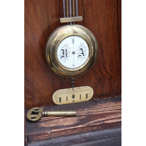 2884A - A VICTORIAN EIGHT DAY WALL CLOCK WITH ROMAN NUMERALS