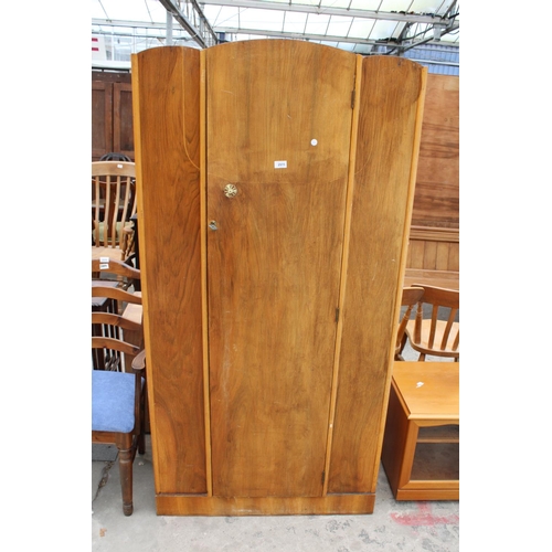 2915 - A MID TWENTIETH CENTURY WALNUT SINGLE DOOR WARDROBE