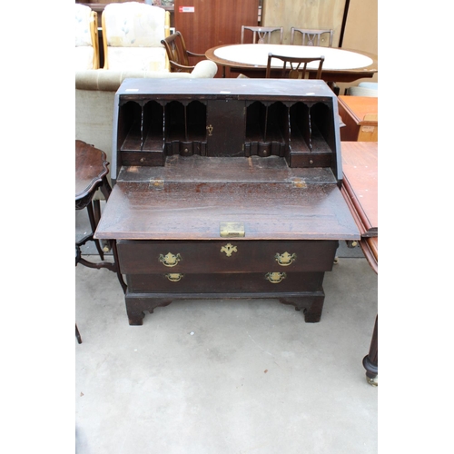 2930 - A GEORGE IV OAK BUREAU WITH FITTED INTERIORS, THREE GRADUATED DRAWERS AND BRACKET FEET, 34.5