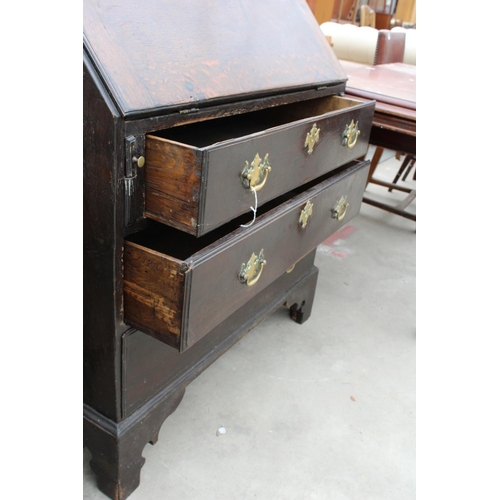 2930 - A GEORGE IV OAK BUREAU WITH FITTED INTERIORS, THREE GRADUATED DRAWERS AND BRACKET FEET, 34.5