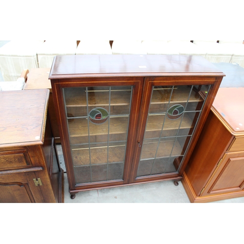 2948 - AN EDWARDIAN MAHOGANY AND INLAID 2 DOOR BOOKCASE WITH COLOURED GLASS, AND LEADED DOORS ON CABRIOLE L... 