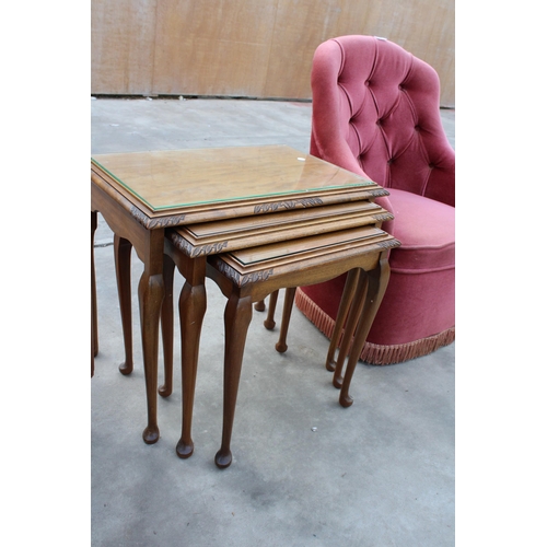 2963 - TWO ITEMS TO INCLUDE A PINK BEDROOM CHAIR AND A NEST OF THREE MAHOGANY TABLES WITH INSERT GLASS TOPS