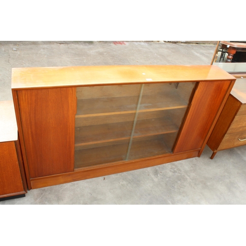 2972 - A MID CENTURY HERBERT E GIBBS, RETRO TEAK BOOKCASE WITH TWO GLASS SLIDING DOORS, WIDTH 153CM