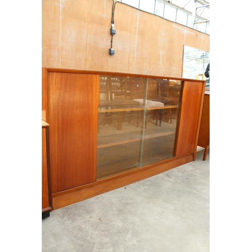 2972 - A MID CENTURY HERBERT E GIBBS, RETRO TEAK BOOKCASE WITH TWO GLASS SLIDING DOORS, WIDTH 153CM