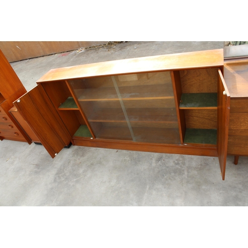 2972 - A MID CENTURY HERBERT E GIBBS, RETRO TEAK BOOKCASE WITH TWO GLASS SLIDING DOORS, WIDTH 153CM