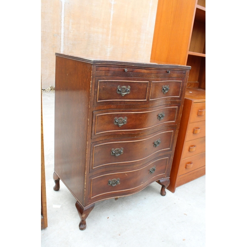 2975 - A REPRODUCTION MAHOGANY SERPENTINE CHEST OF DRAWERS WITH PULL OUT WRITING SLIDE AND FOUR LONG DRAWER... 