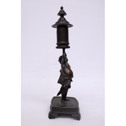 301 - A BRONZE MEIJI PERIOD STATUE OF A FIGURE HOLDING A VASE WITH COVER