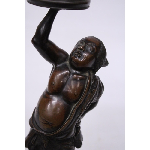 301 - A BRONZE MEIJI PERIOD STATUE OF A FIGURE HOLDING A VASE WITH COVER