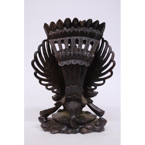 322 - A WOOD CARVING OF GARUDA WITH THE GOD VISHNU - 29 CM (H)