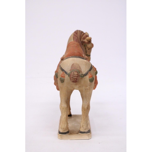 323 - A CHINESE HORSE IN THE STYLE OF A TANG DYNASTY WARRIOR HORSE - 30 CM INCLUDE BASE