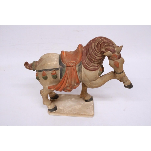 323 - A CHINESE HORSE IN THE STYLE OF A TANG DYNASTY WARRIOR HORSE - 30 CM INCLUDE BASE