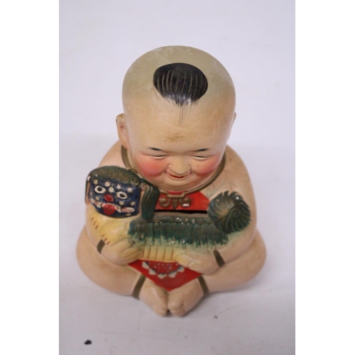 325 - A VINTAGE HUISHAN CLAY FIGURINE BUDDHA BOY SAVINGS BANK