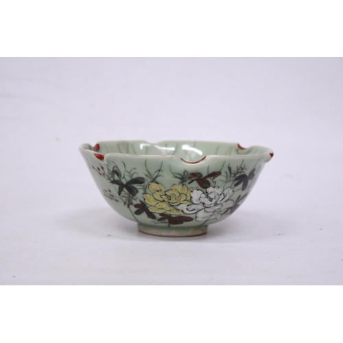 331 - A CHINESE PORCELAIN GLAZED FOOTED BOWL WITH FLORAL DECORATION