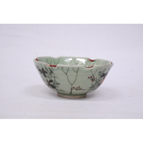 331 - A CHINESE PORCELAIN GLAZED FOOTED BOWL WITH FLORAL DECORATION