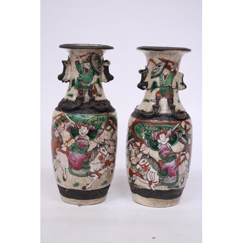 335 - A PAIR OF CHINESE CRACKLE GLAZED VASES WITH WARRIOR SCENES - 18 CM (H) - MARK TO BASE