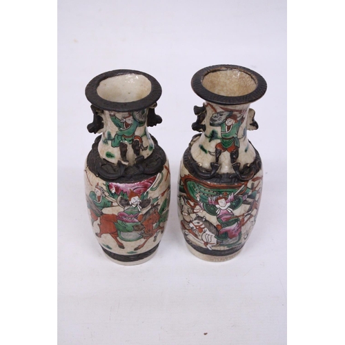 335 - A PAIR OF CHINESE CRACKLE GLAZED VASES WITH WARRIOR SCENES - 18 CM (H) - MARK TO BASE