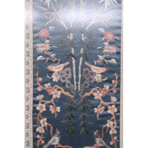 338 - THREE CHINESE SILK EMBROIDERIES DEPICTING A LANDSCAPE SCENE, BIRDS AND FLORALS IN BAMBOO FRAMES