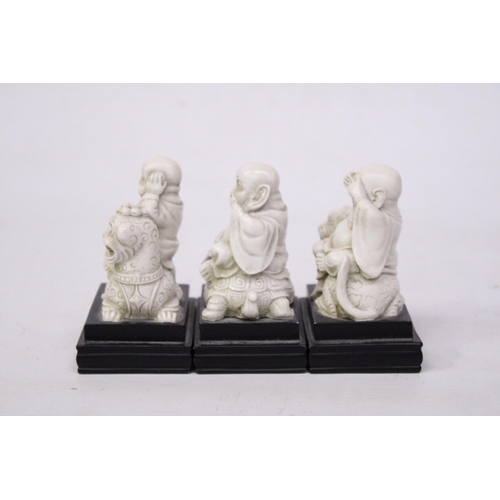 356 - A SET OF BUDDAH FIGURES ON WOODEN PLINTHS - SEE, HEAR AND SPEAK NO EVIL