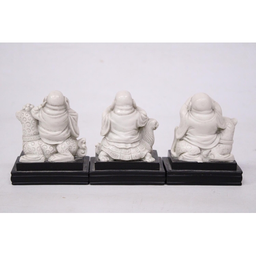 356 - A SET OF BUDDAH FIGURES ON WOODEN PLINTHS - SEE, HEAR AND SPEAK NO EVIL