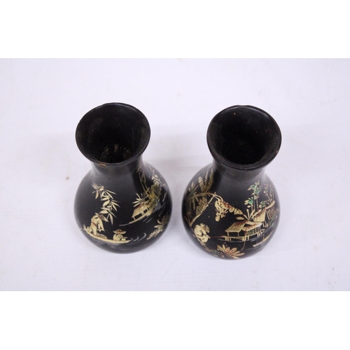 362 - A PAIR OF FOOTED WOODEN LACQUER VASES WITH ORIENTAL SCENES - 14 CM (H)