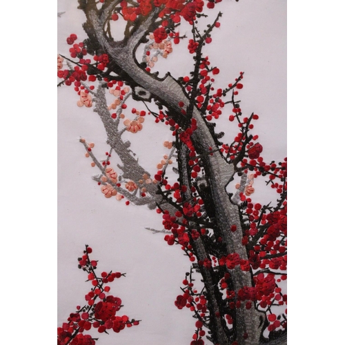 374 - A JAPANESE EMBROIDERY OF CHERRY BLOSSOMS FRAMED AND GLAZED - 78 CM X 29 CM