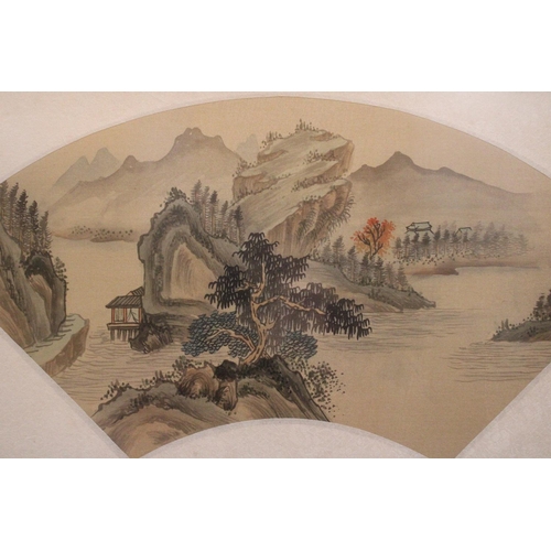 377 - A CHINESE FAN PAINTING OF A LANDSCAPE IN BAMBOO FRAME - 49 X 29 CM