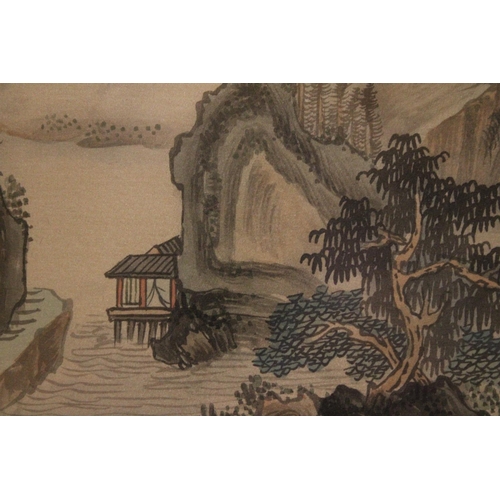 377 - A CHINESE FAN PAINTING OF A LANDSCAPE IN BAMBOO FRAME - 49 X 29 CM