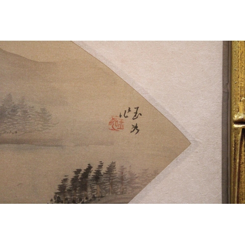 377 - A CHINESE FAN PAINTING OF A LANDSCAPE IN BAMBOO FRAME - 49 X 29 CM